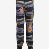 Black pants worn by a person, showing the pants' fit