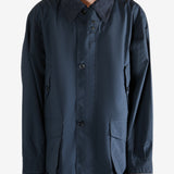 Navy jacket worn by a person, showing the jacket's fit