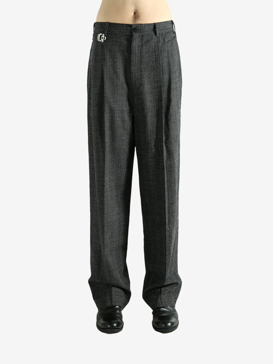 Black pants worn by a person, showing the pants fit