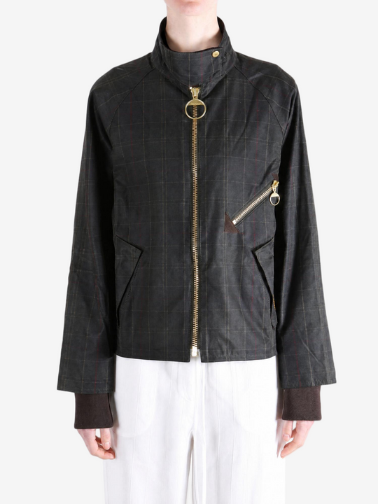 Black jacket worn by a person, showing the jacket fit
