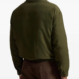 Green jacket worn by a person, showing the jacket fit