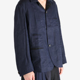 Blue jacket worn by a person, showing the jacket fit