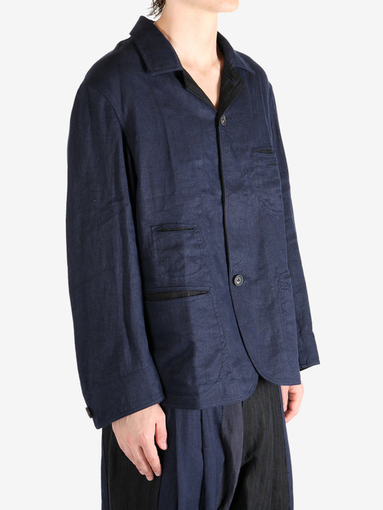 Blue jacket worn by a person, showing the jacket fit