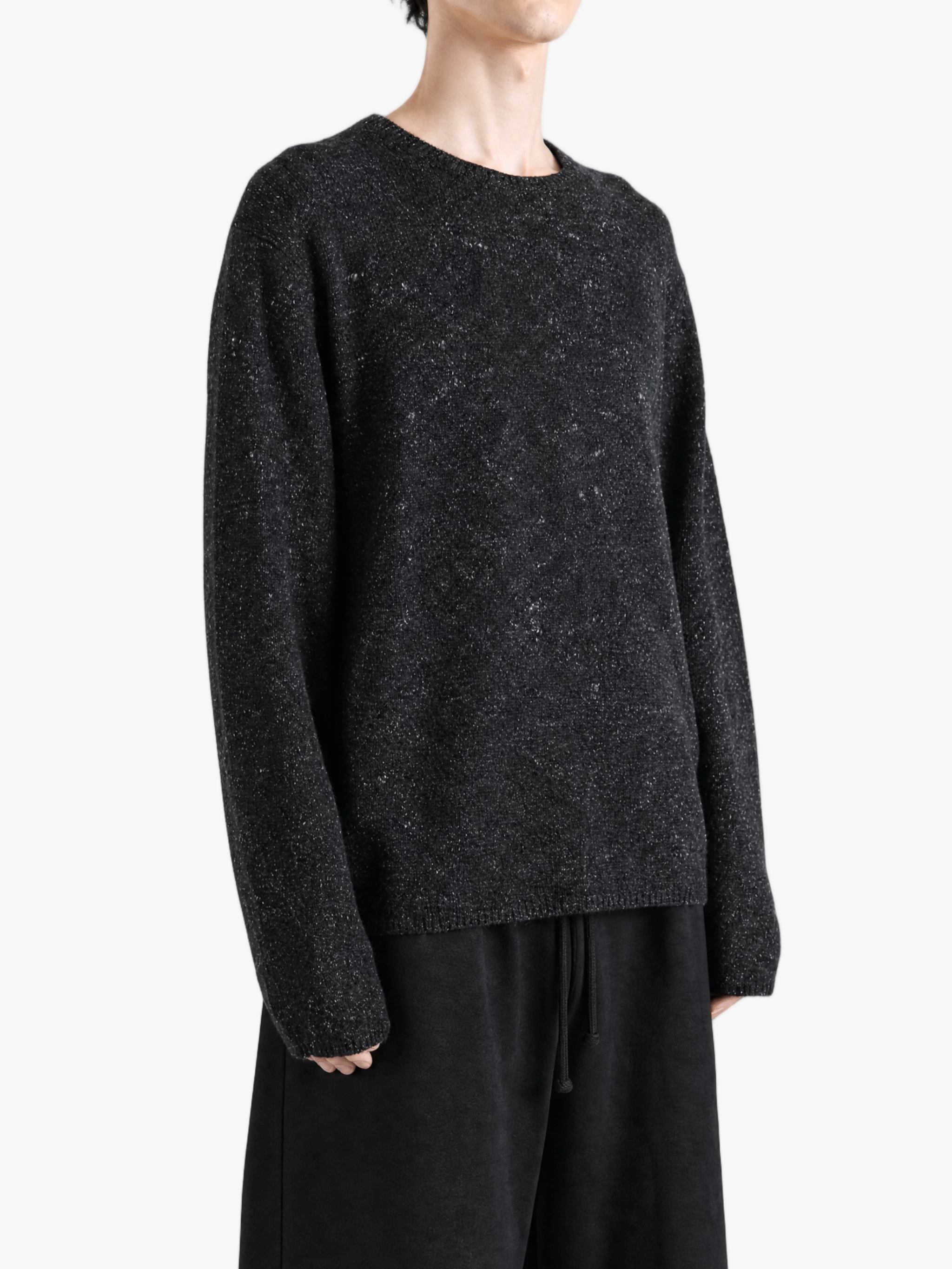 Black top worn by a person, showing the top fit