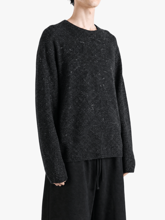Black top worn by a person, showing the top fit