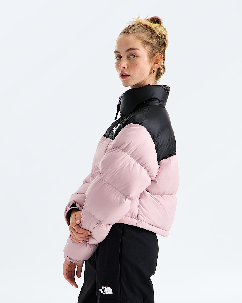 Pink jacket worn by a person, showing the jacket fit