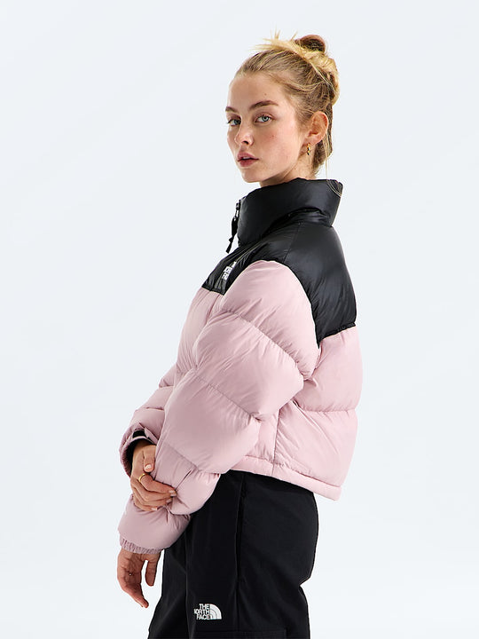 Pink jacket worn by a person, showing the jacket fit