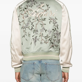 Green jackets-coat worn by a person, showing the jackets-coat's fit