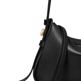 Close up of black bag, showing texture of the leather fabric