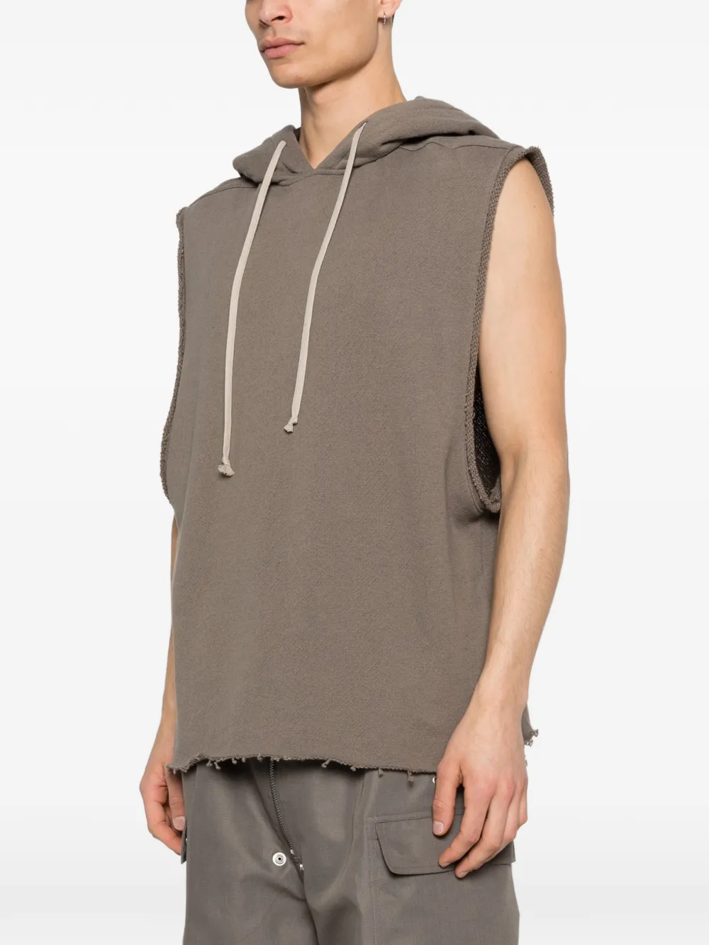 Brown hoodie worn by a person, showing the hoodie fit