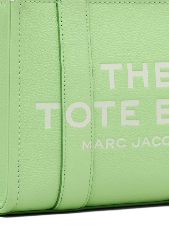 Close up of green bags,showing texture of the leather fabric.