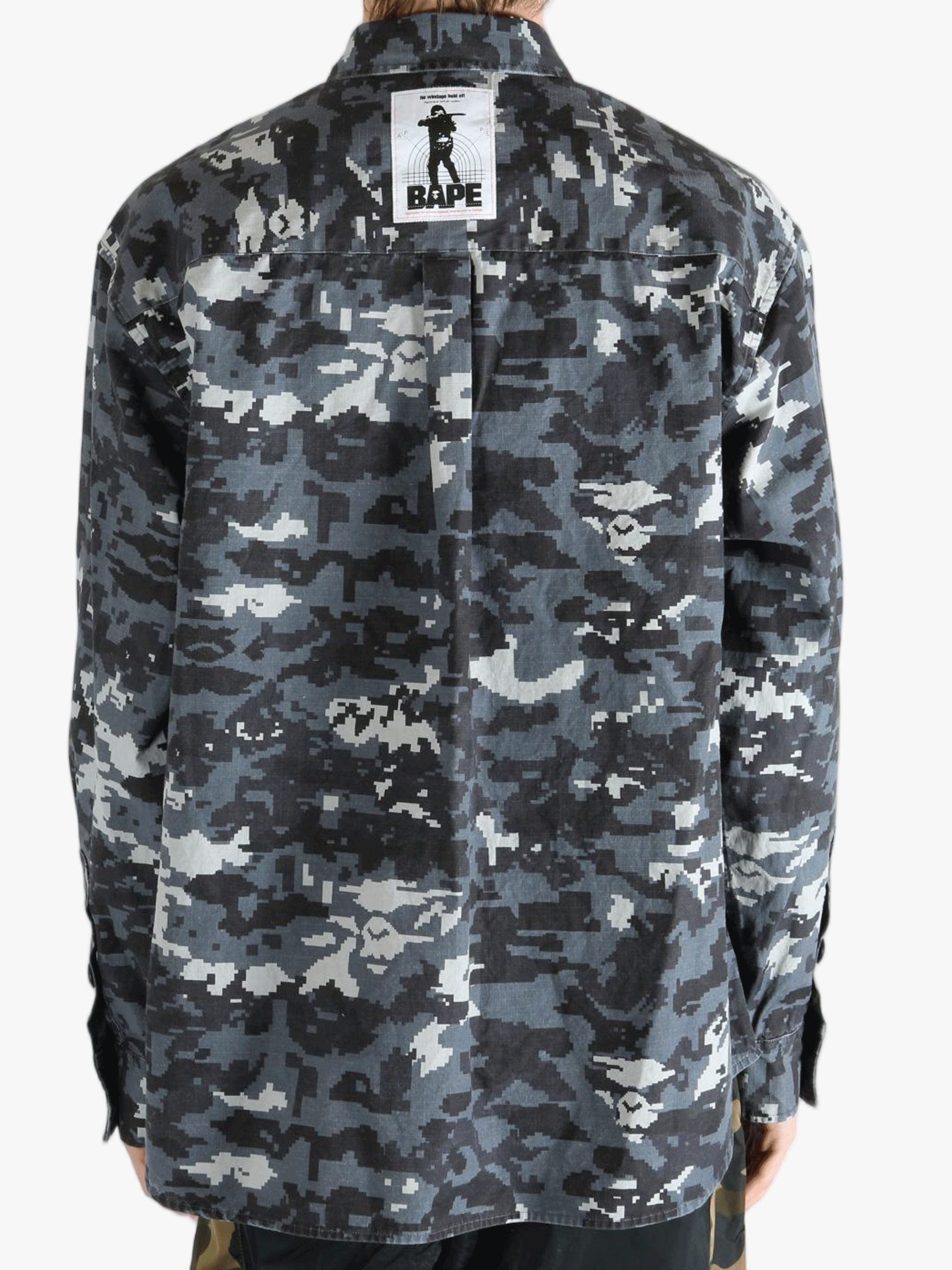 Black shirt worn by a person, showing the fit