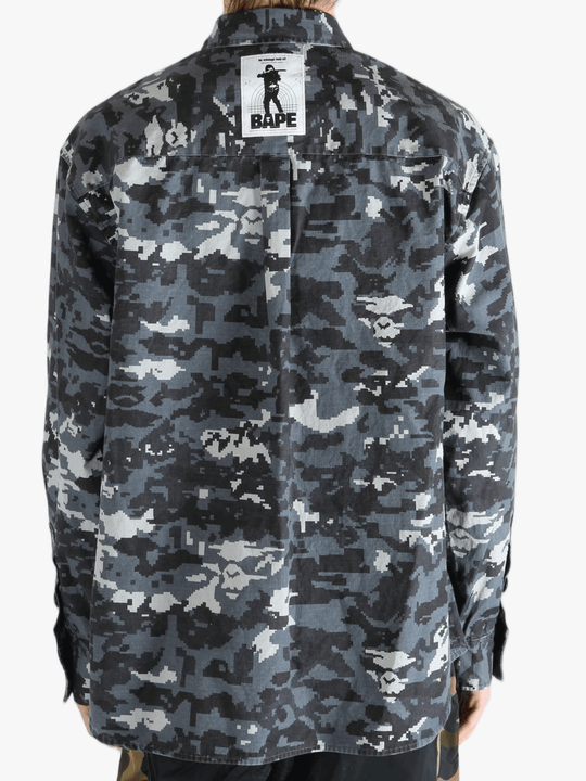 Black shirt worn by a person, showing the fit