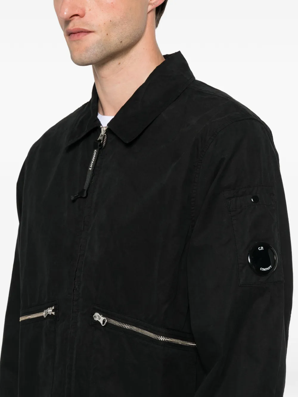 Close up of the black coats, showing texture of the cotton fabric