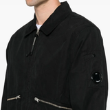 Close up of the black coats, showing texture of the cotton fabric