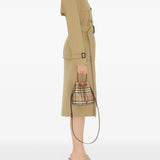 Brown bag carried by a person, showing the bag’s fit