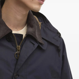 close up of blue jackets and coats, showing texture of the cotton  fabric
