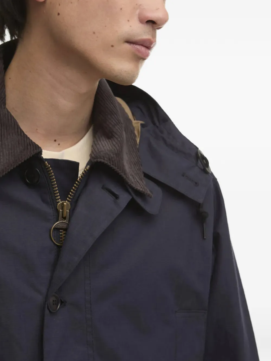 close up of blue jackets and coats, showing texture of the cotton  fabric
