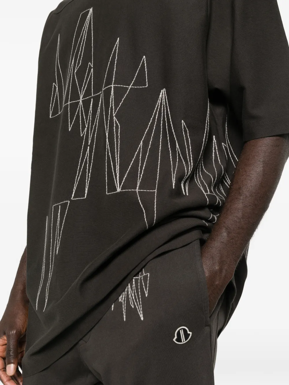 Close up of brown t-shirt, showing the texture of cotton fabric