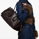 Brown bag worn by a person, showing the bag fit