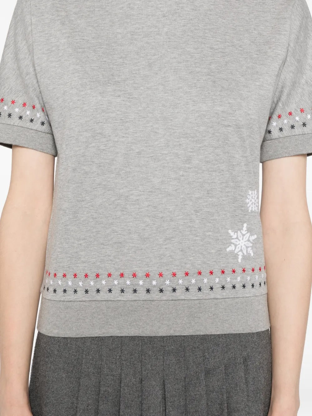 Grey t-shirt worn by a person, showing the t-shirt's fit