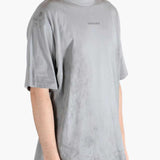 Grey t-shirt worn by a person, showing the t-shirt's fit
