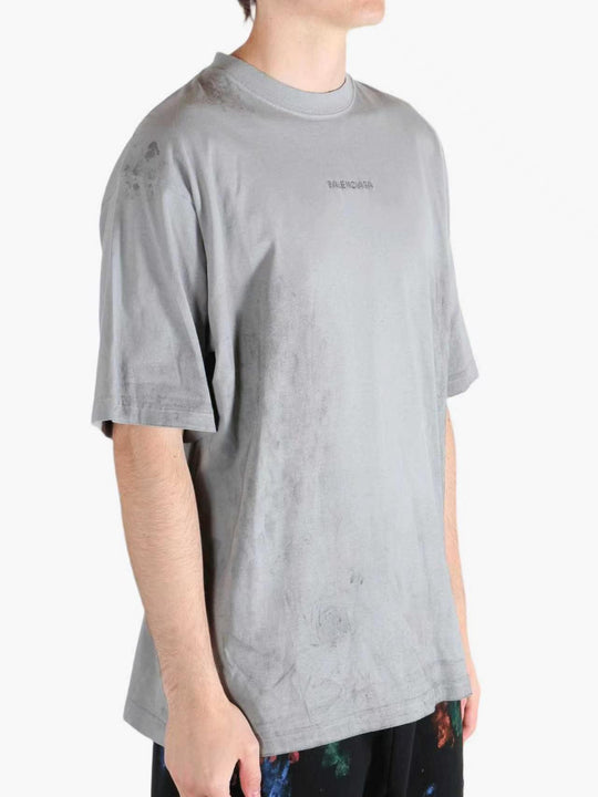 Grey t-shirt worn by a person, showing the t-shirt's fit