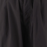 Close up of black pants, showing the fabric of sythenic material