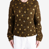 Brown jacket worn by a person, showing the jacket fit