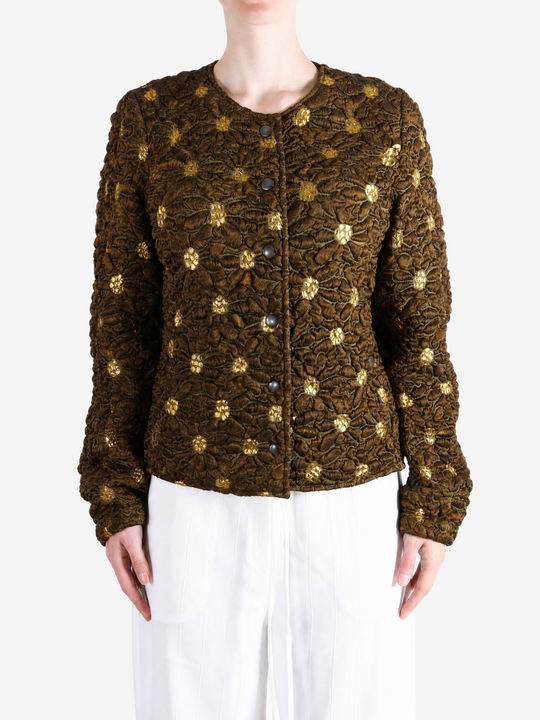 Brown jacket worn by a person, showing the jacket fit