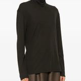 Brown top worn by a person, showing the top's fit