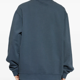 blue sweat, worn by a person, showing the sweat fit