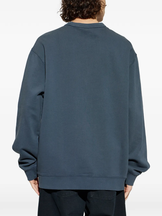 blue sweat, worn by a person, showing the sweat fit