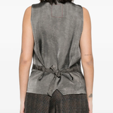 Tan coats worn by a person, showing the coats fit