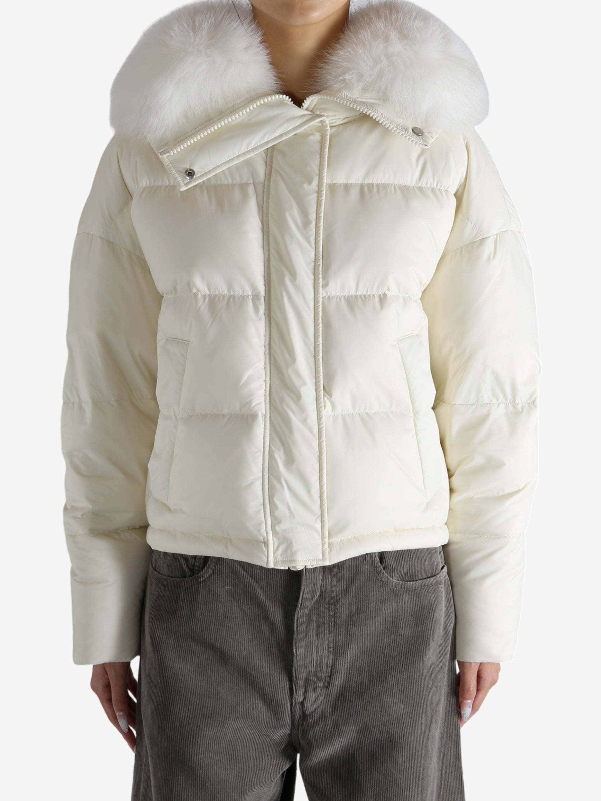 White jacket worn by a person, showing the jacket's fit