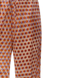 Close up of brown pant, showing texture of the silk fabric