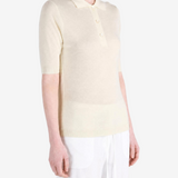 Tan knitwear worn by a person, showing the knitwear fit