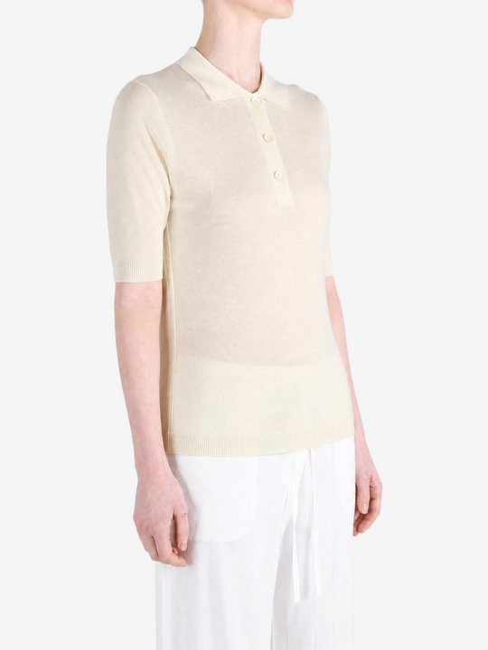 Tan knitwear worn by a person, showing the knitwear fit