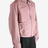 Pink jacket worn by a person, showing the jacket fit