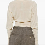 Tan top worn by a person, showing the top fit