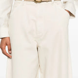Close up of the white pants, showing texture of the cotton fabric