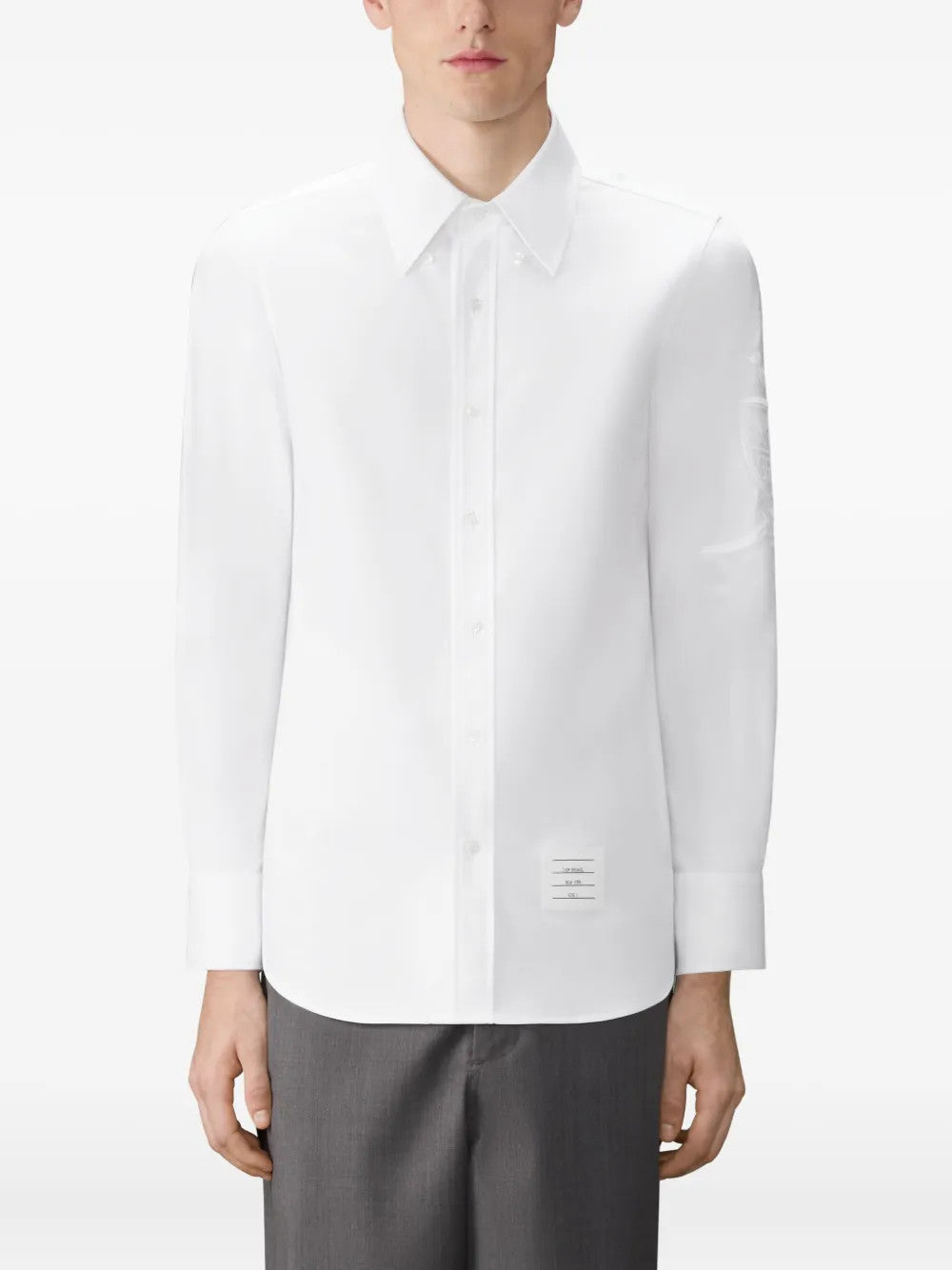 White shirt worn by a person, showing the shirt fit