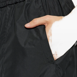 Close up of Black pants, showing texture of the 65% cotton/ 35% polyester fabric