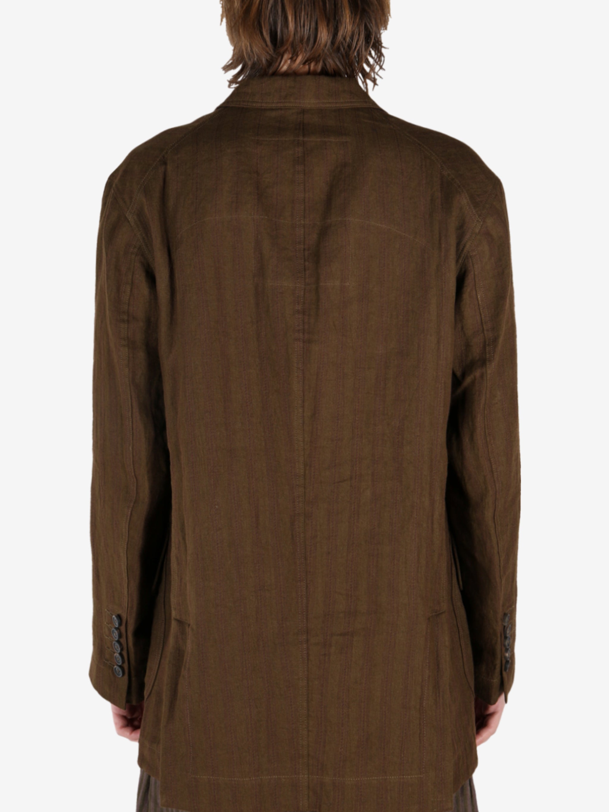 Brown jacket worn by a person, showing the jacket's fit