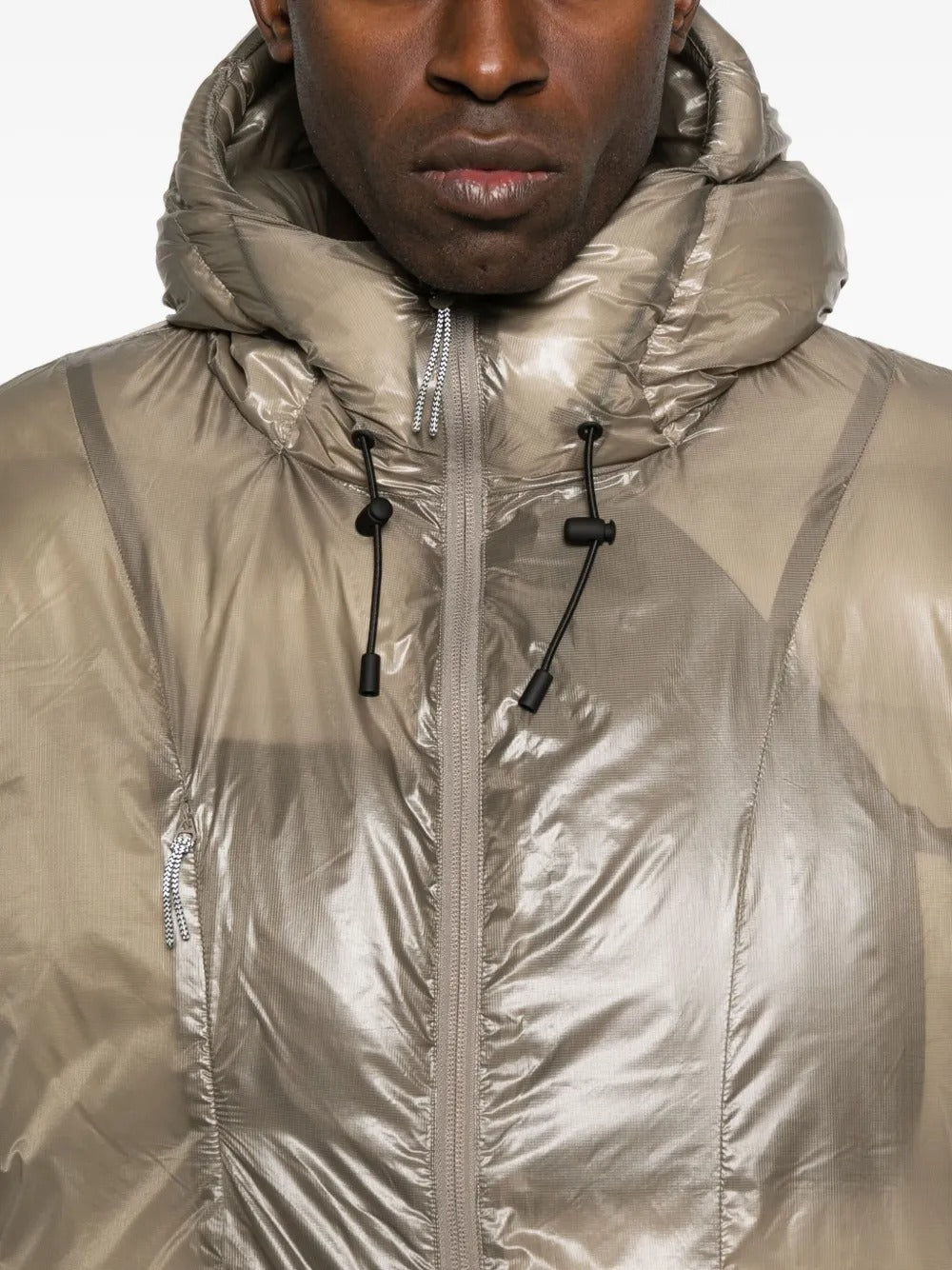 Close up of tan jackets, showing texture of the polyester fabric