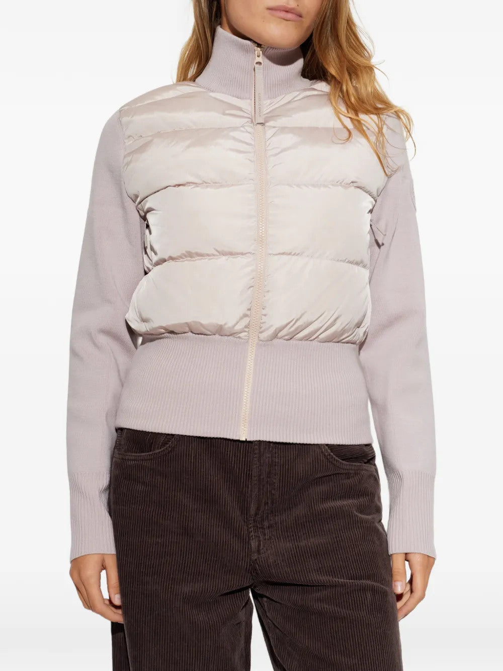 Tan jacket worn by a person, showing the jacket fit