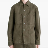 Green shirt worn by a person, showing the shirt's fit