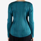 Green top worn by a person, showing the top fit