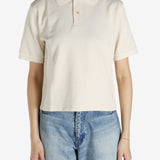 White shirt worn by a person, showing the shirt's fit