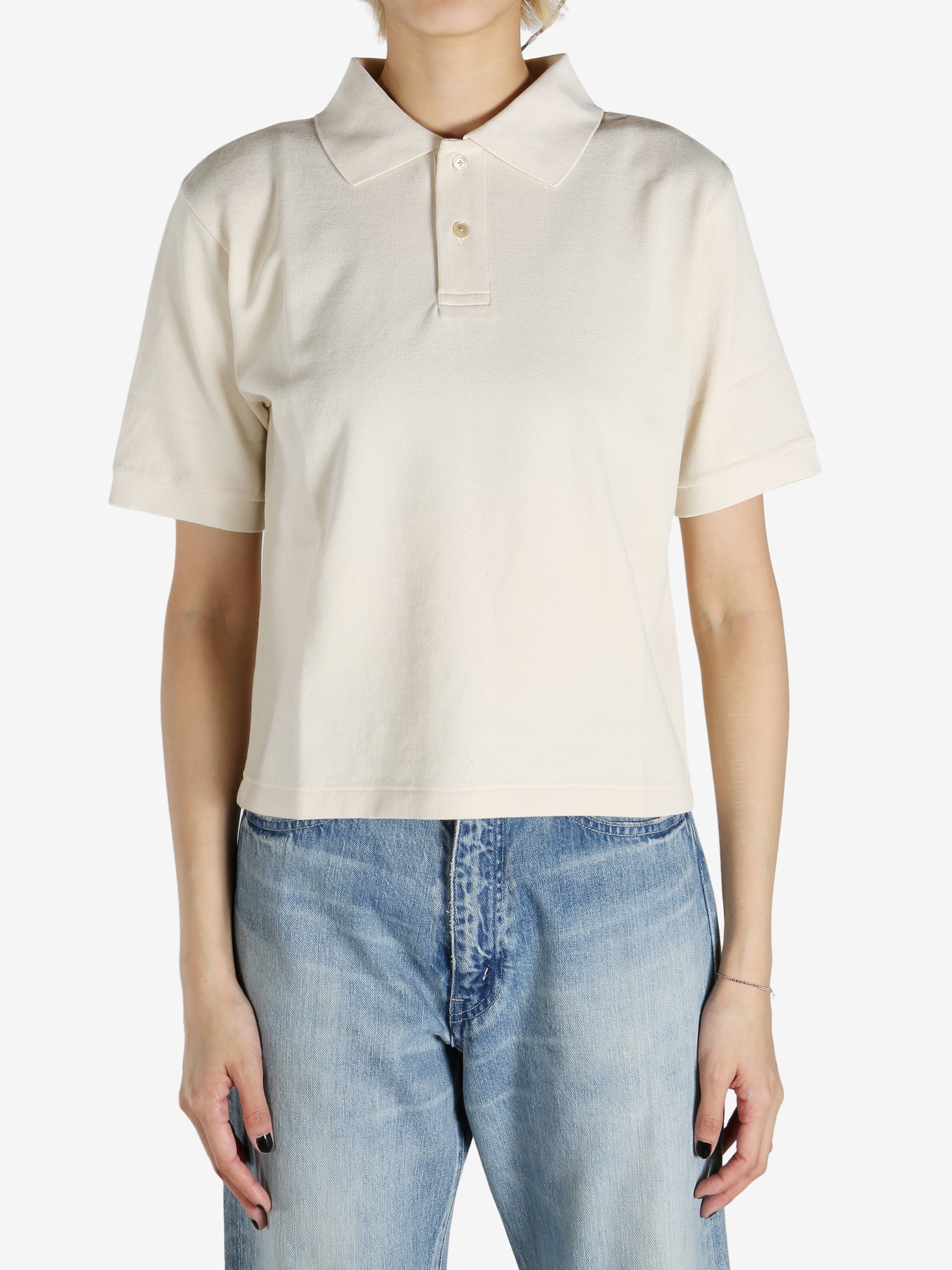 White shirt worn by a person, showing the shirt's fit